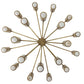 A radial chandelier with a central gold-toned metal hub and twelve thin spokes extending outward to cylindrical shades with white centers and gold outer rims, shown on a plain white background.