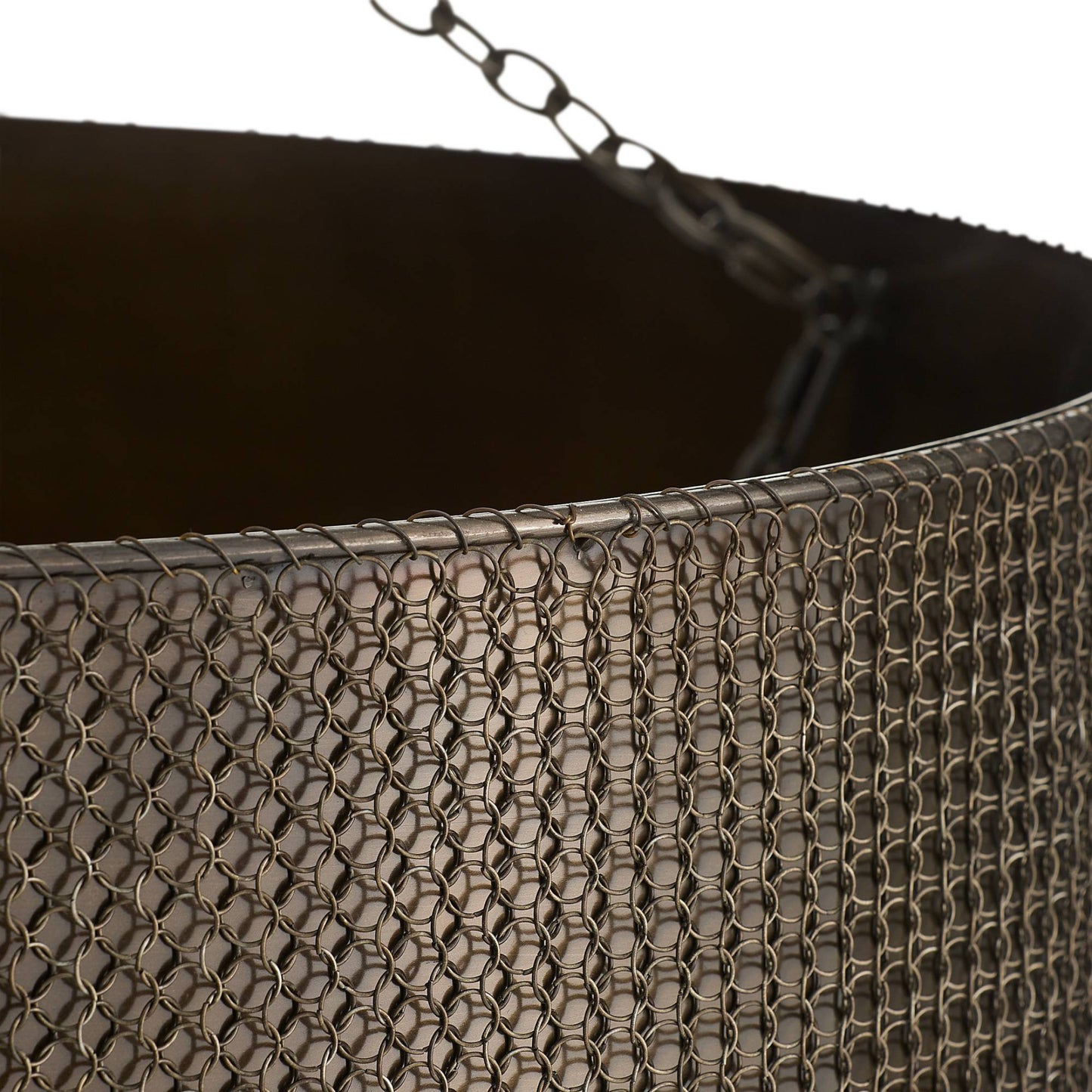 Close-up of a textured metal basket with a chain handle on a white background