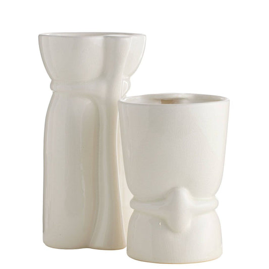 Two white ceramic tiki mugs on a white background
