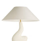 Table lamp with a white base and beige shade on a white background