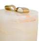 Jar with a gold bow-shaped lid on a white background