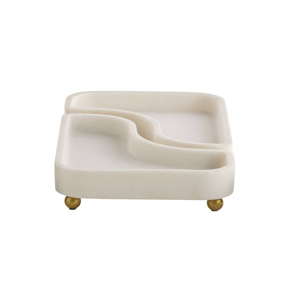 Beige ceramic dish with gold feet on a white background