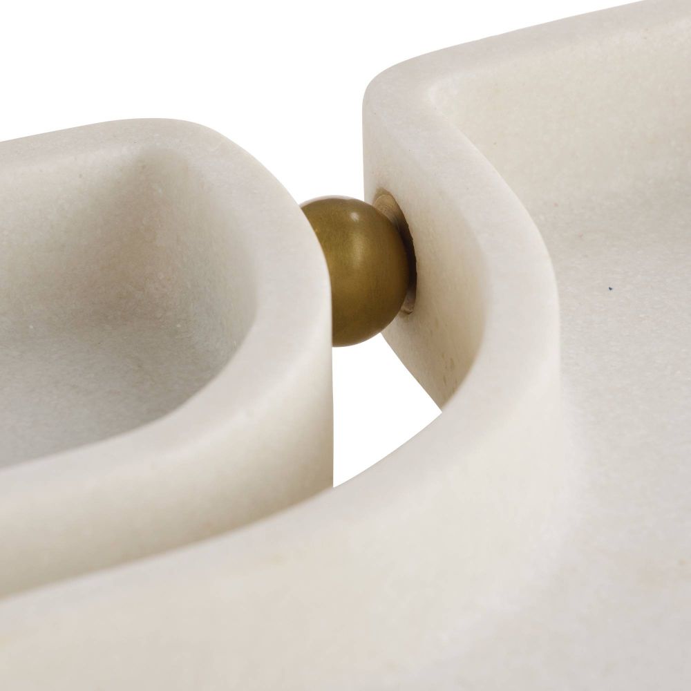 Close-up of a white ceramic vase with a gold accent on a white background