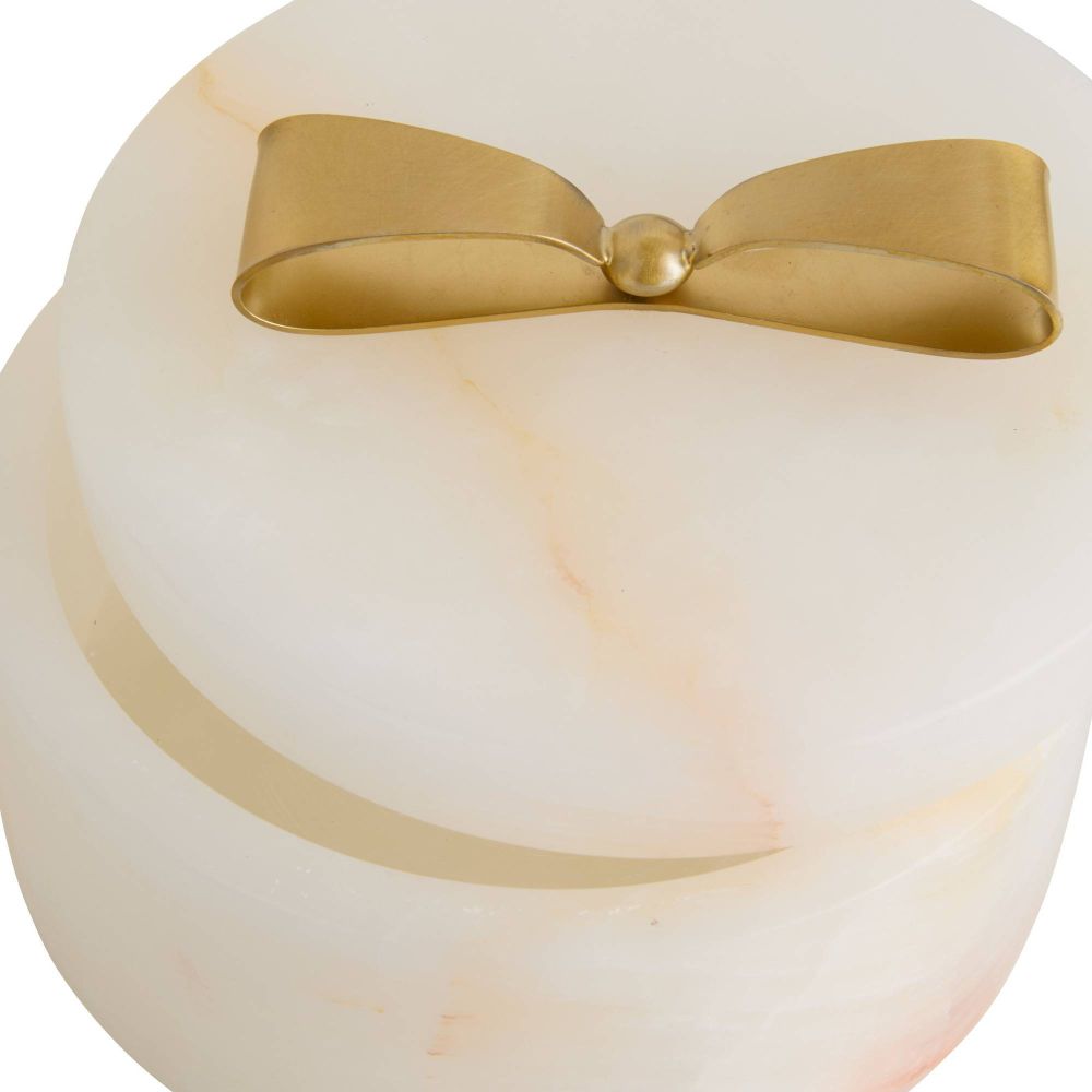 Decorative item with a gold bow on a white background