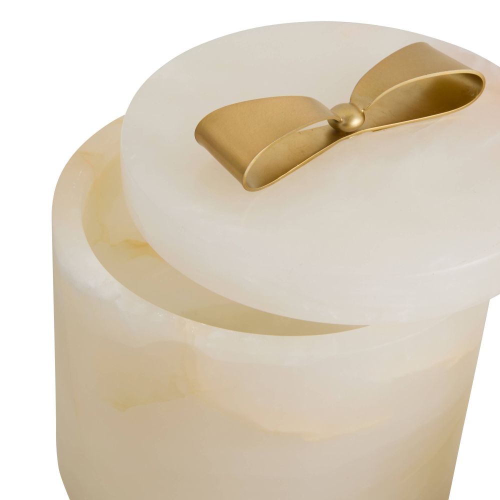 Cream-colored container with a gold bow on a white background