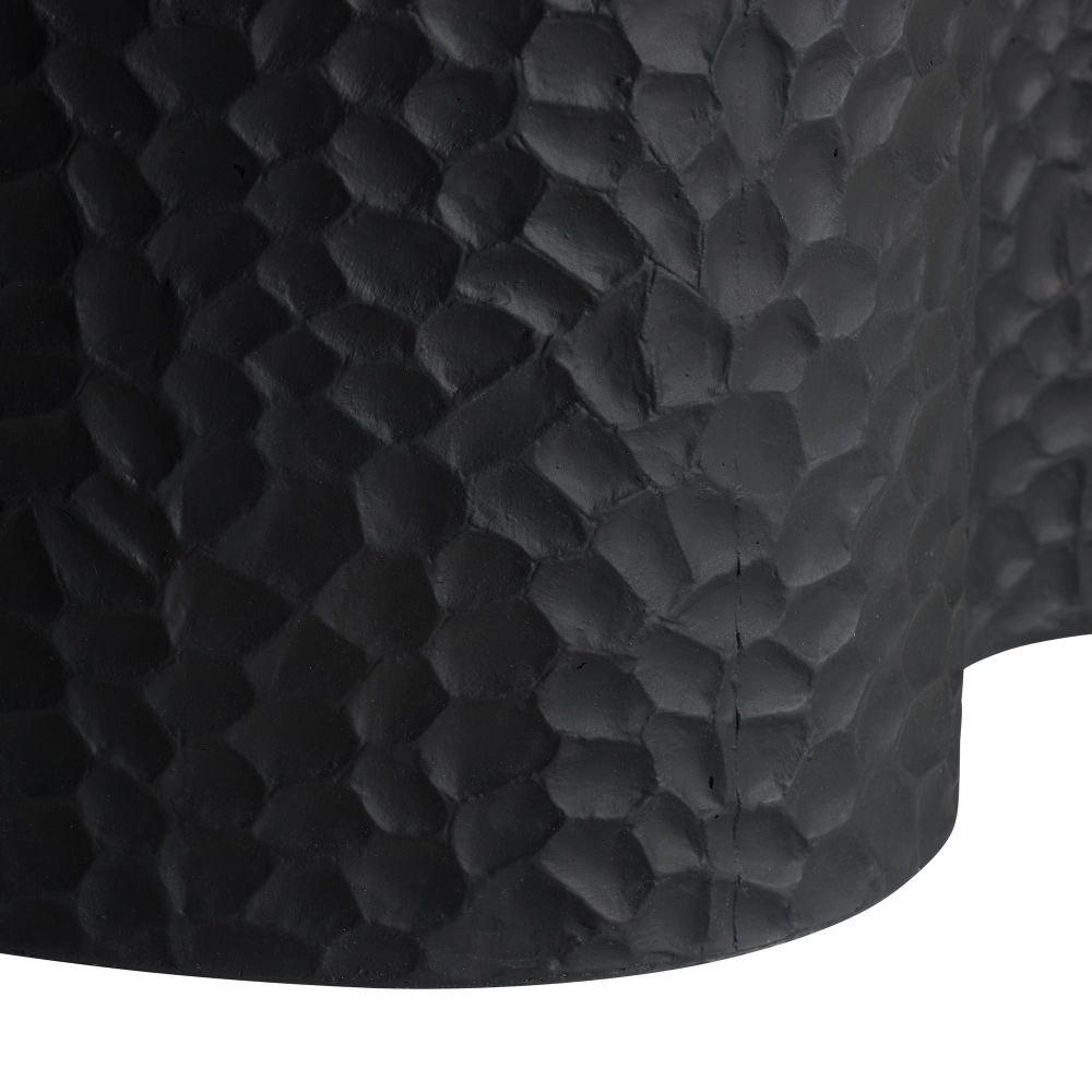 Close-up of a textured black surface with a diamond pattern
