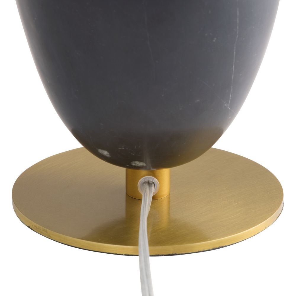 Black lampshade on a gold base with a white cord, on a white background