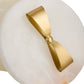 Gold bow-shaped object on a white background