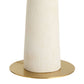 White cylindrical object with a gold base on a white background