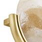Close-up of a gold handle on a textured surface