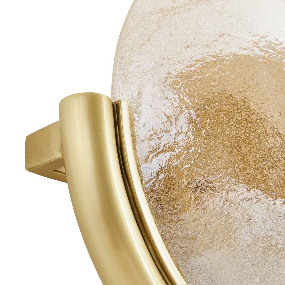 Close-up of a gold handle on a textured surface