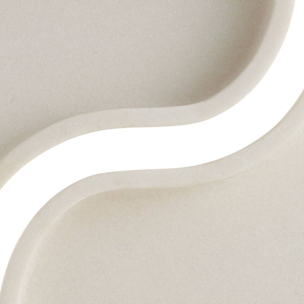 Close-up of a curved, beige ceramic vase on a white background