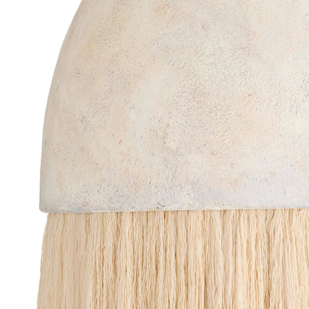 Close-up of a hair extension with a light beige cap and blonde hair.