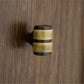 Decorative cabinet knob on a wooden surface