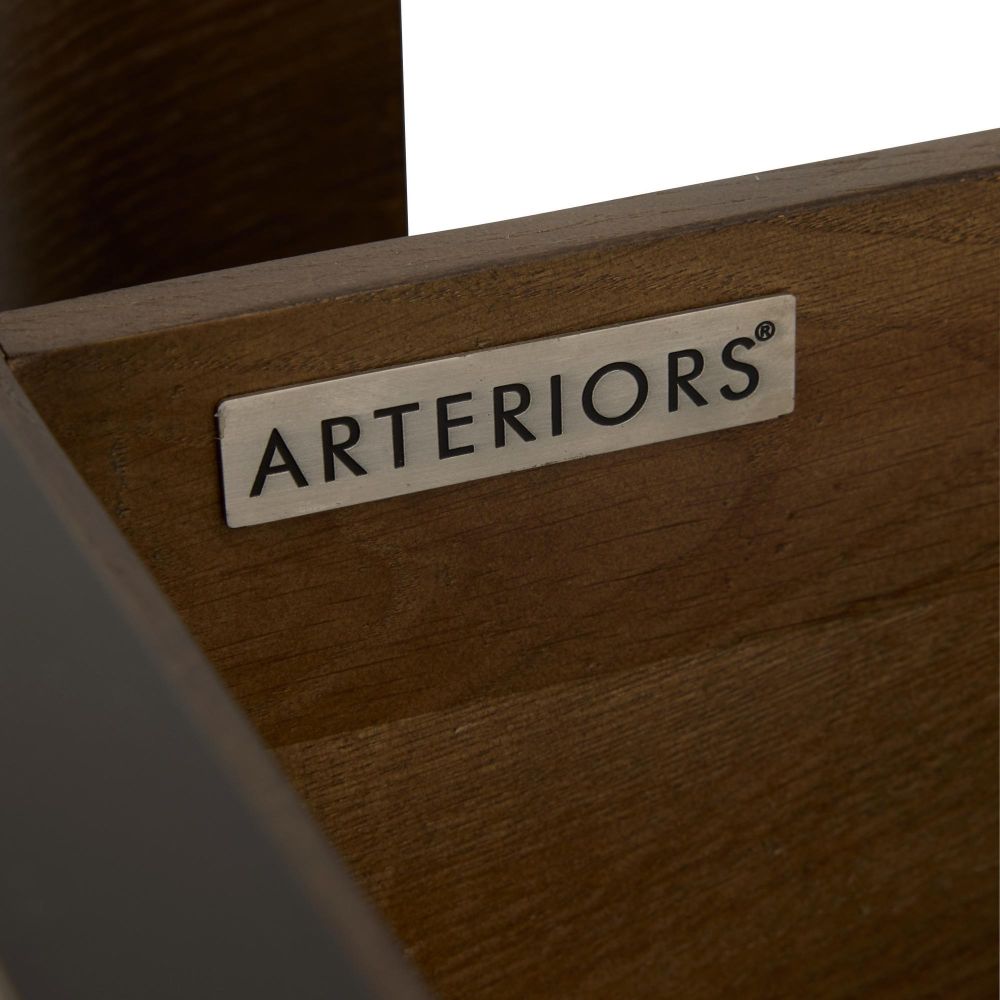 Wooden product with 'Arteriors' label on a blurred background