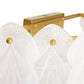 Gold towel rack with white towels on a white background