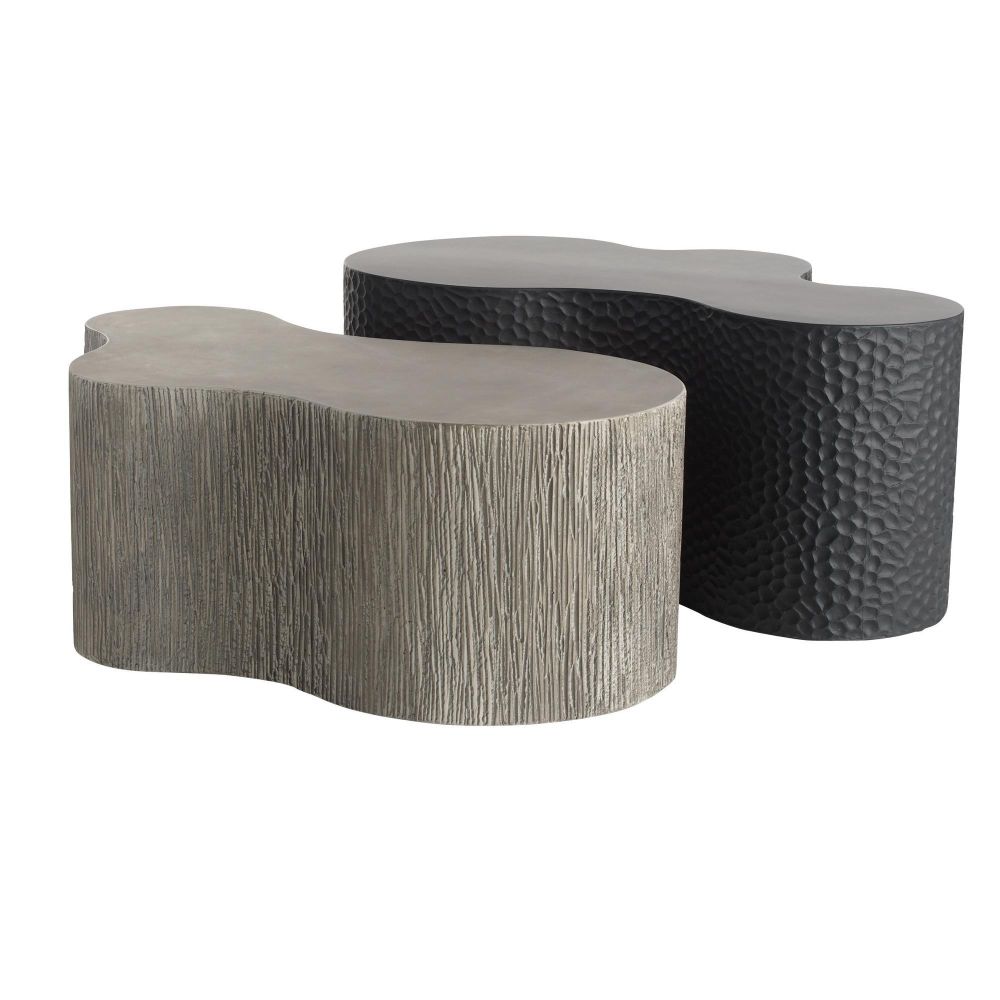 Two decorative stone tables with different textures on a white background