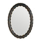 Oval mirror with decorative black frame on a white background
