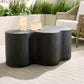 Black textured coffee table with candles on a patio setting