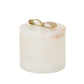 White marble holder with a gold accent on a white background