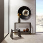 Modern interior with a console table, mirror, and decorative items.