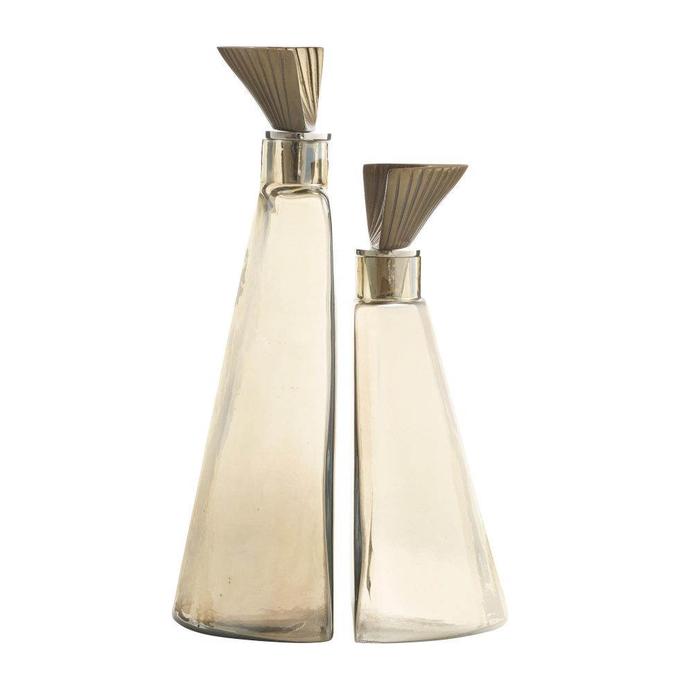 Two glass bottles with metallic nozzles on a white background