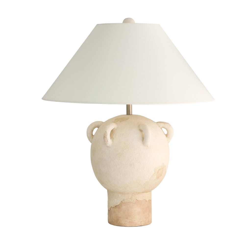 Ceramic table lamp with a white shade on a white background