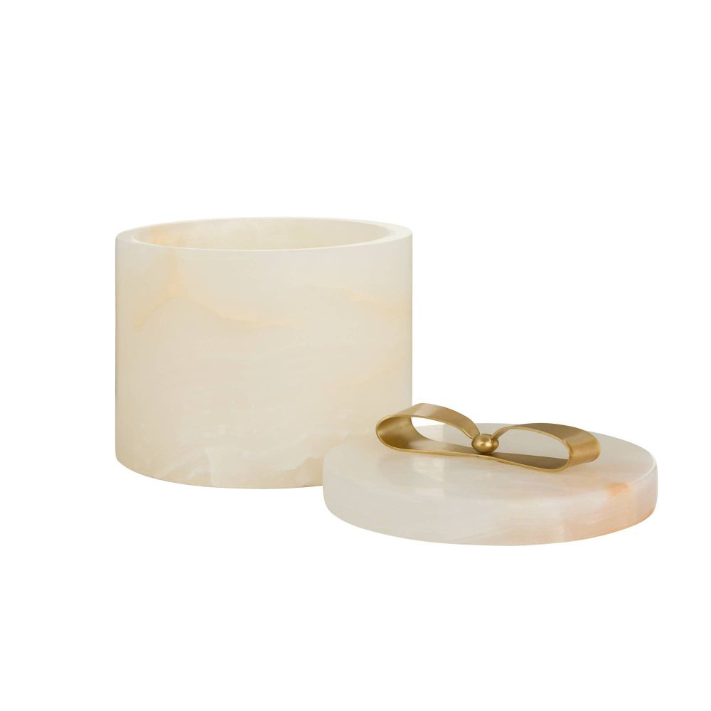 White cylindrical container with a gold lid on a white background