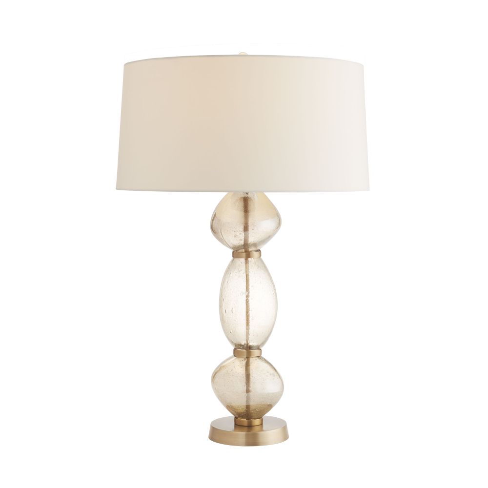 Table lamp with a beige shade and gold base on a white background