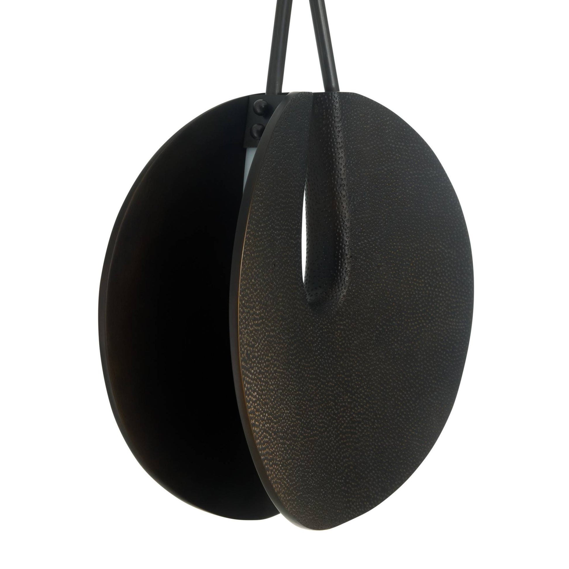 Black leather earring on a white background