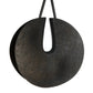 Black textured circular pendant on a white background