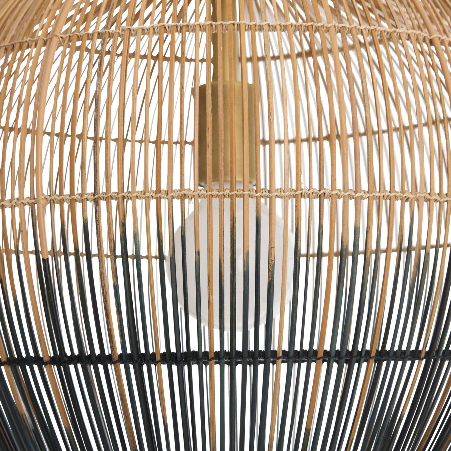 Close-up of a woven rattan lampshade with black accents