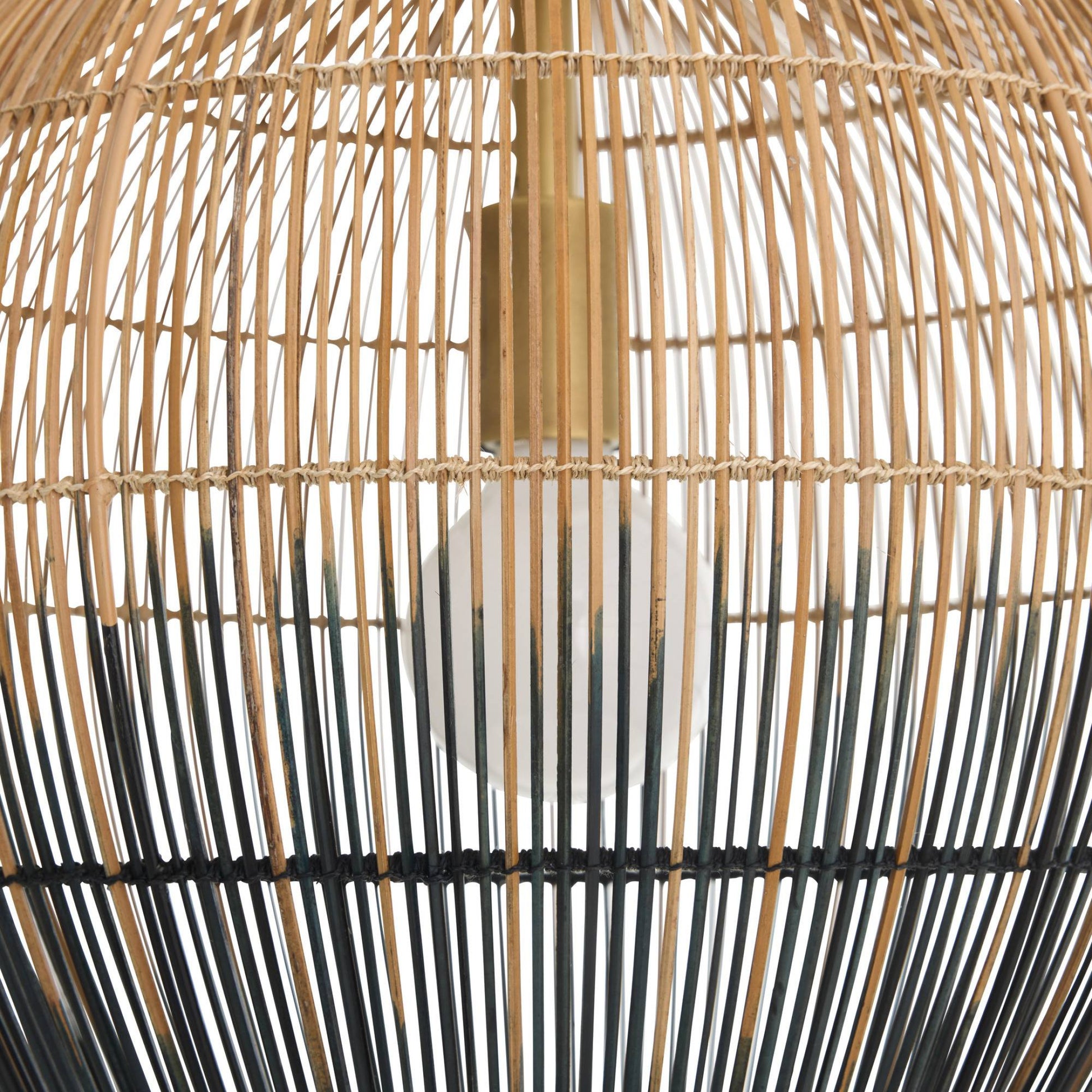 Close-up of a woven rattan lampshade with black accents