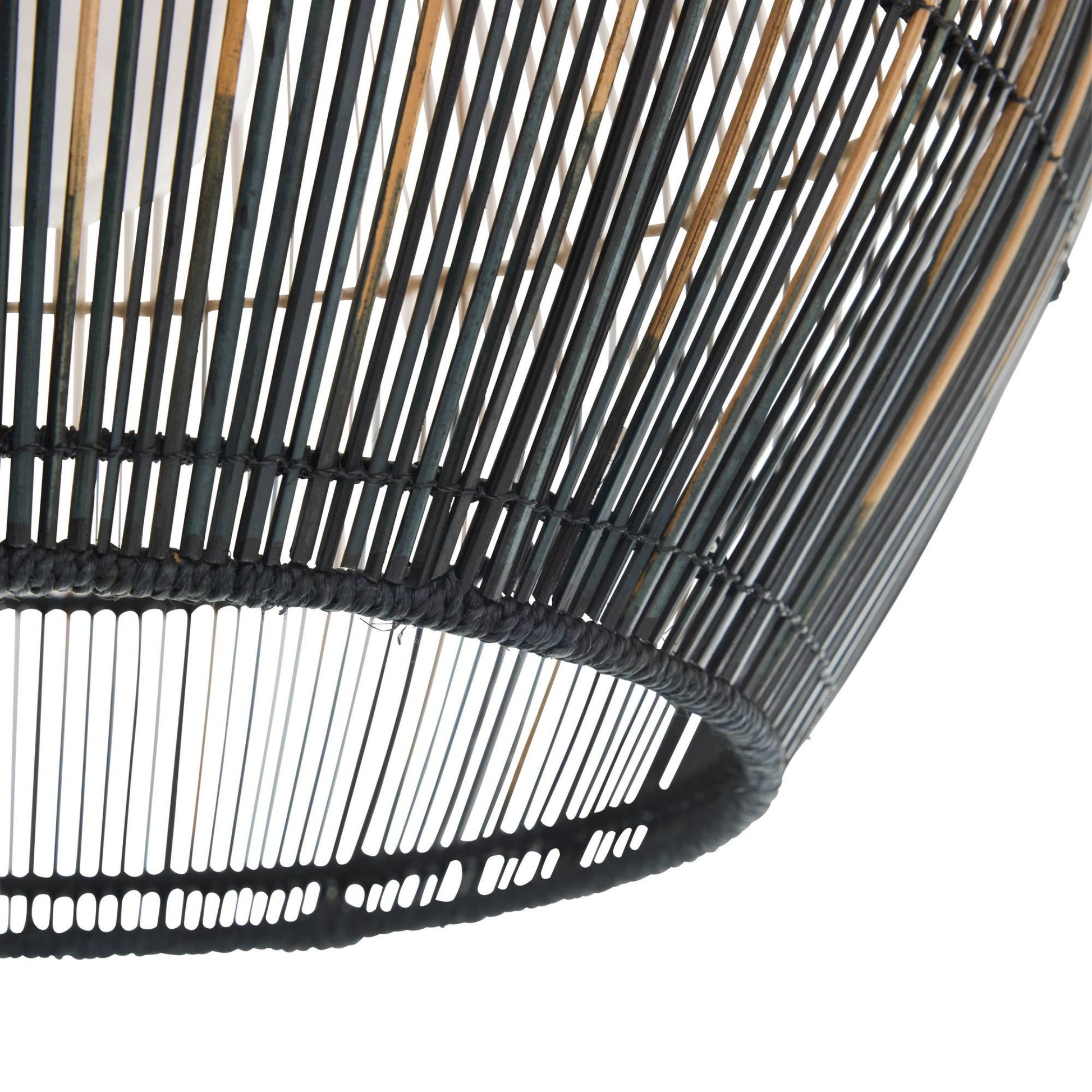 Close-up of a black woven basket on a white background