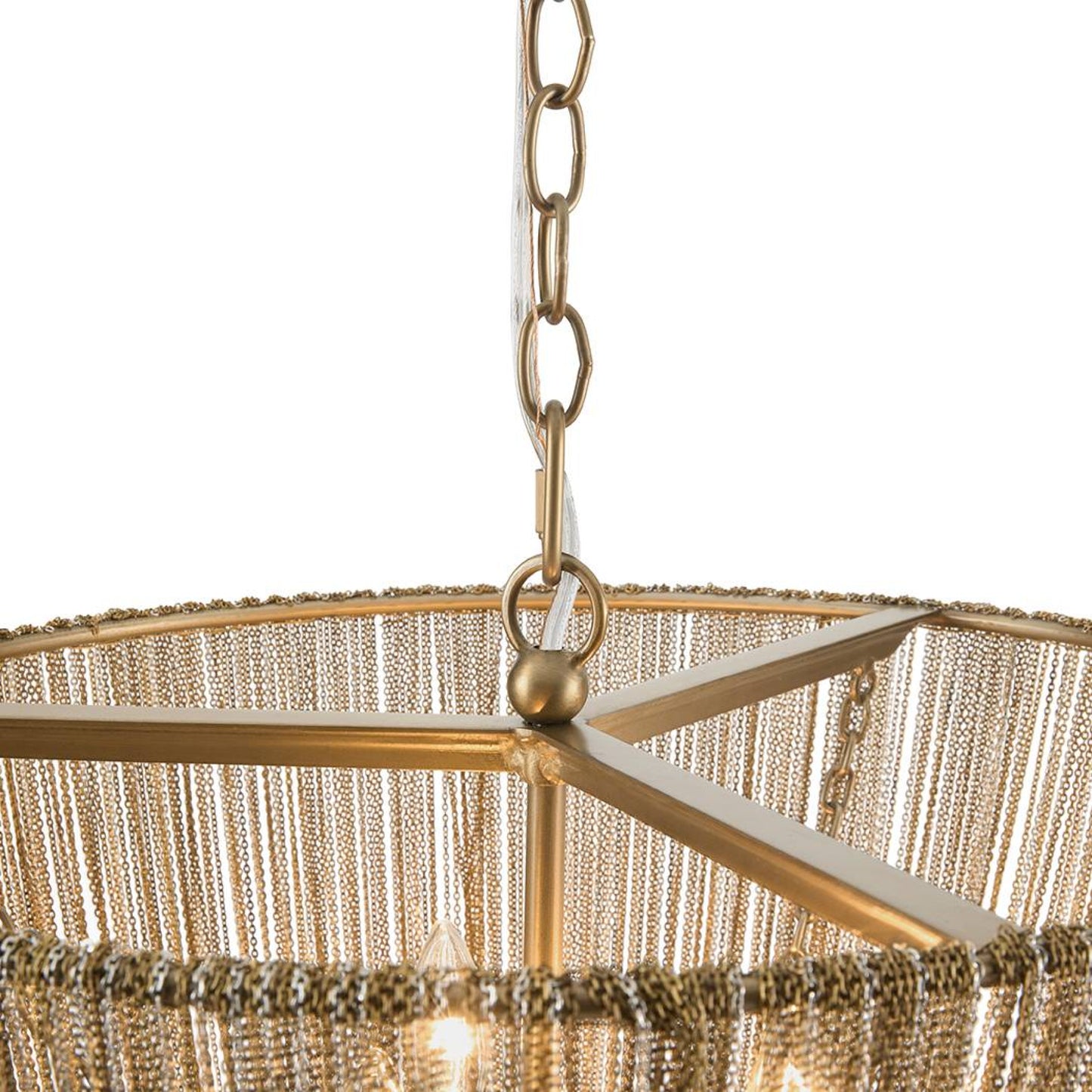 Close-up of a hanging chandelier shade with a gold-tone metal frame, chain, and dense fringe detailing against a white background.