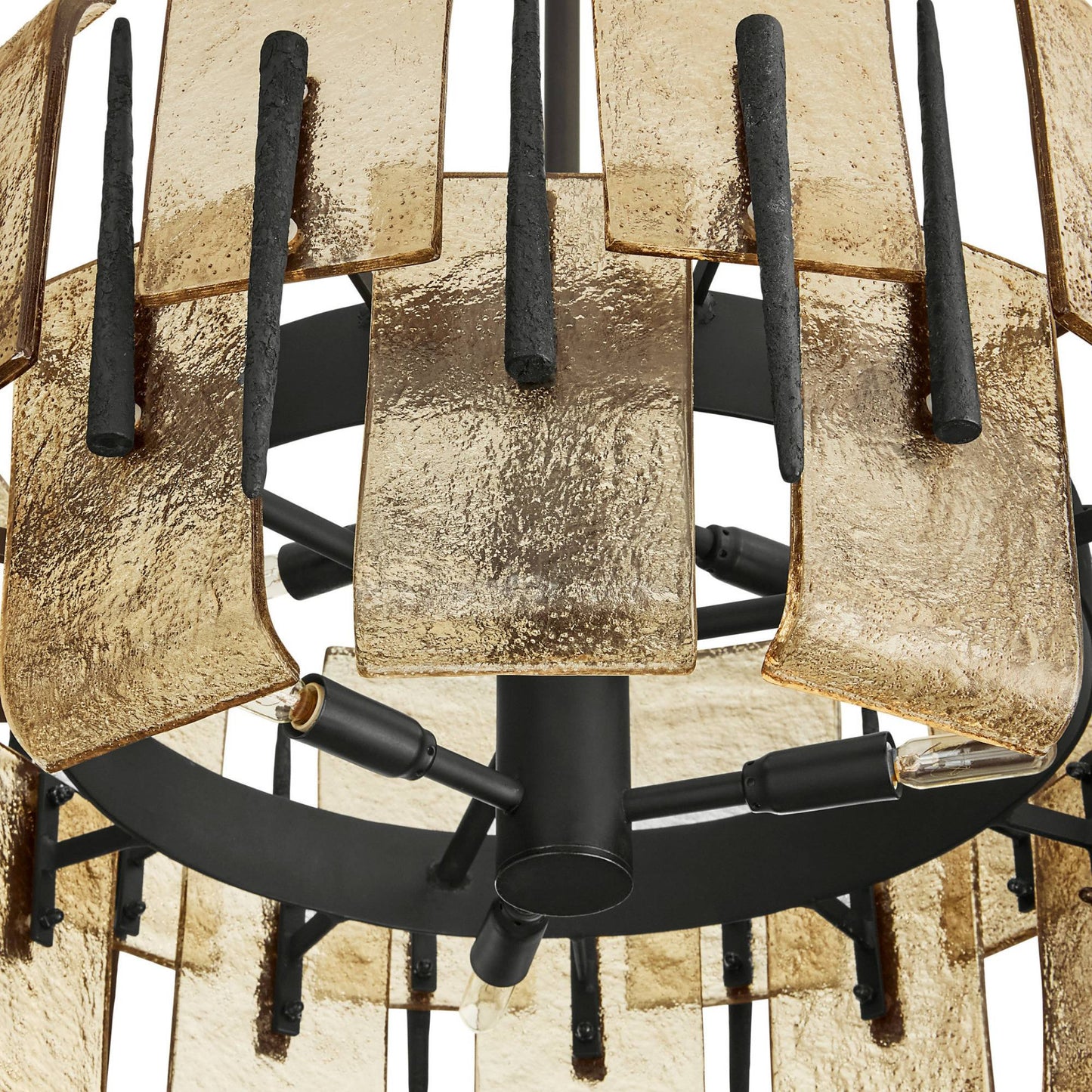 Close-up of a metal grill with black and gold components on a white background