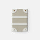 Small leather pouch with white stripe and gold accents on a light gray background