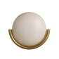 Wall sconce with a white globe and gold metal fixture on a white background