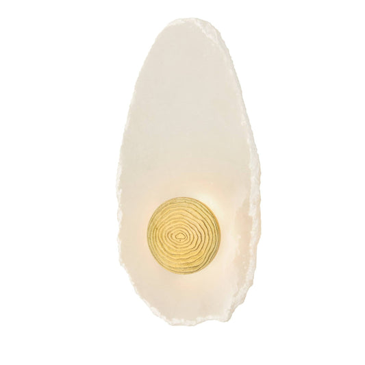 A modern wall sconce featuring a natural, irregularly shaped off-white stone base with a circular gold-toned concentric ring detail in the center, shown against a plain white background.