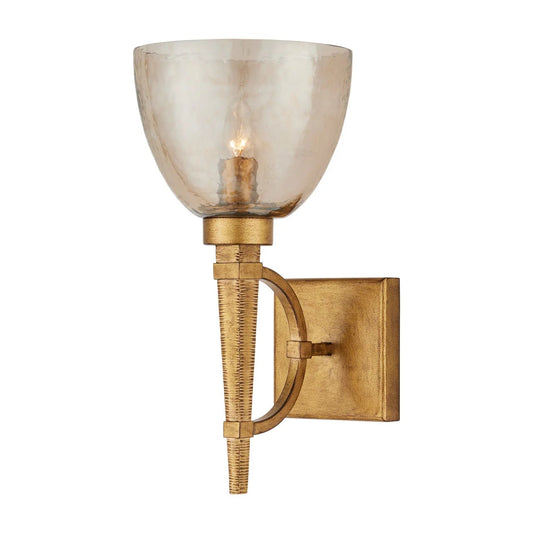 Gold wall sconce with a glass shade on a white background
