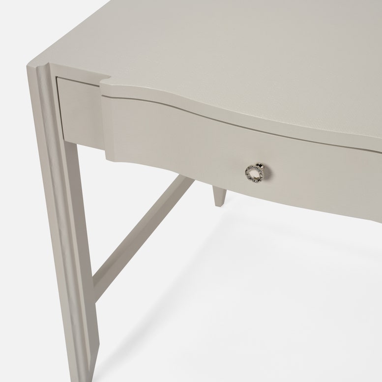 Light gray desk with a drawer on a white background