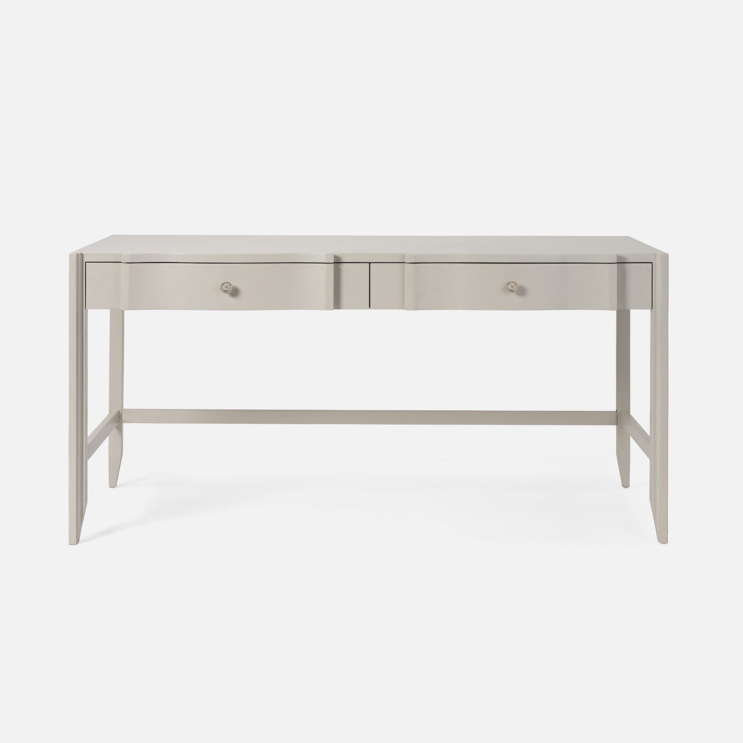 Light gray console table with drawers on a white background