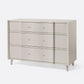 Beige dresser with four drawers on a white background