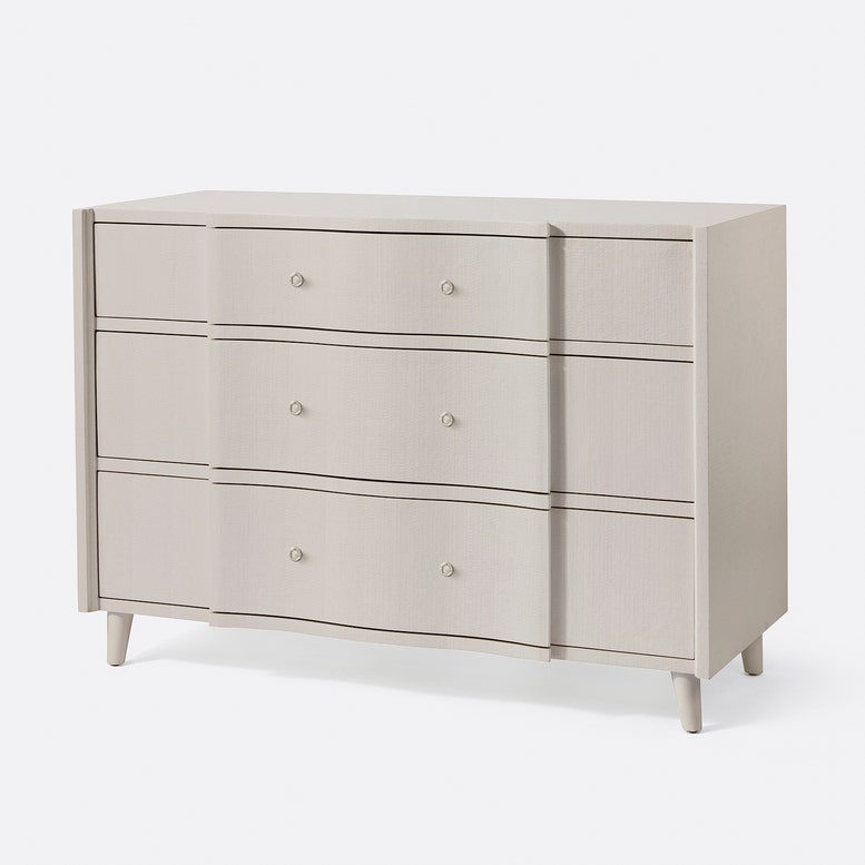 Beige dresser with four drawers on a white background