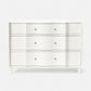 White dresser with silver knobs on a white background
