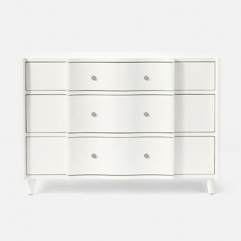 White dresser with silver knobs on a white background