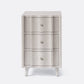 Three-drawer cabinet with textured finish and white legs on a white background