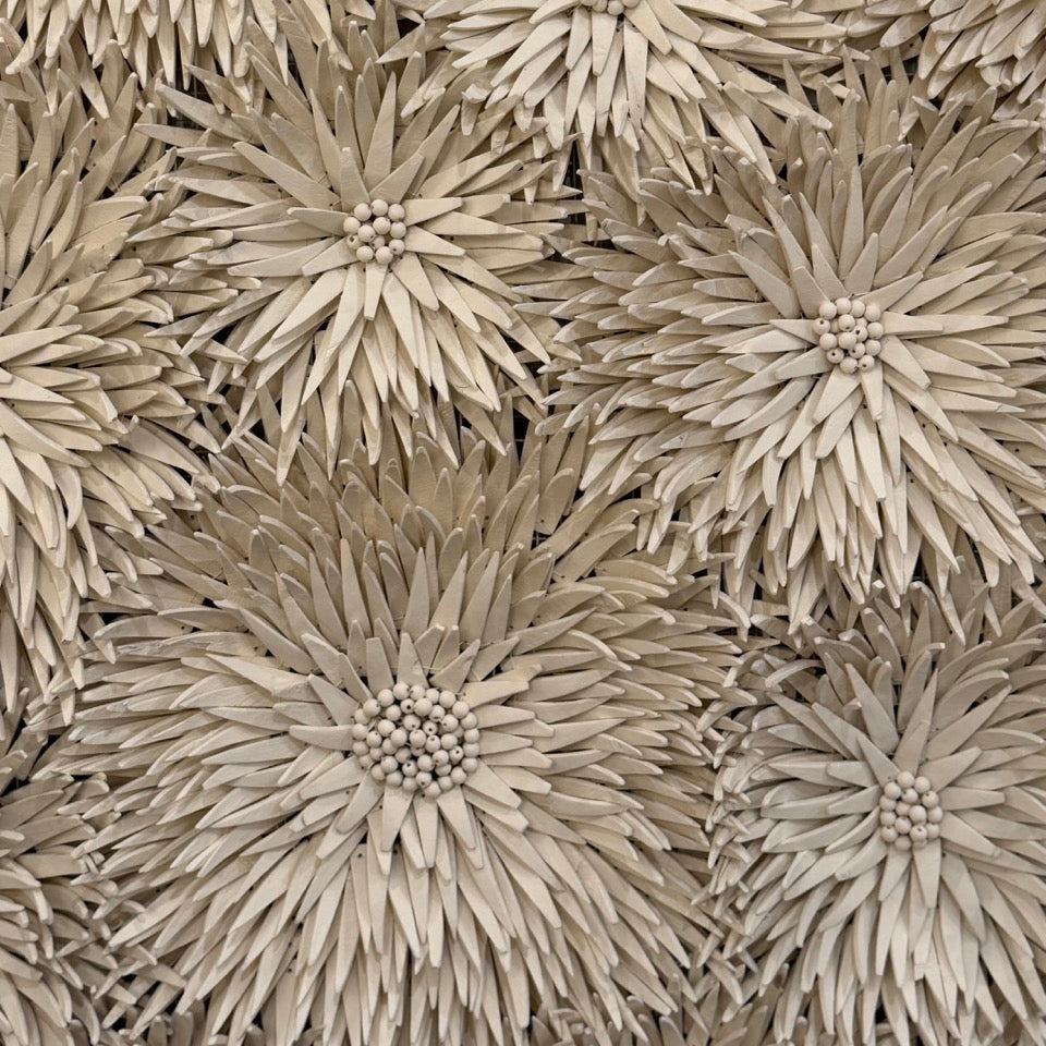 Close-up of decorative floral pattern on a textured surface
