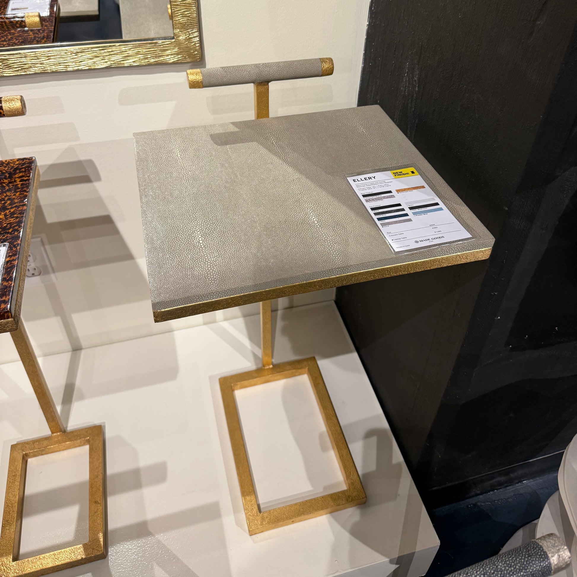 Gold-framed mirror on a white wall with a box labeled 'Product' in the foreground.