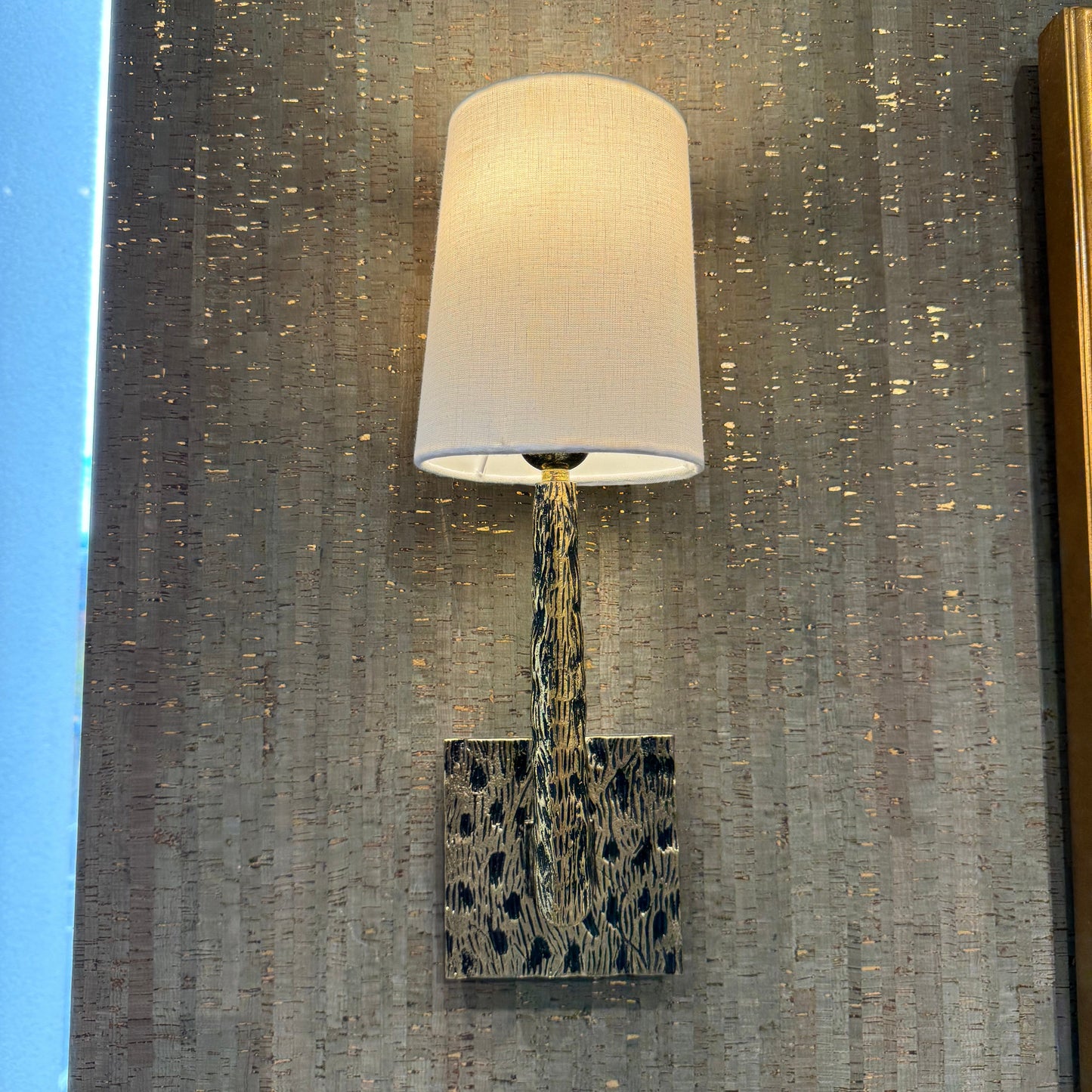 Wooden spatula with a cylindrical handle on a textured surface